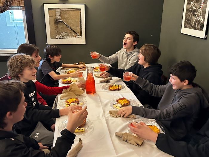 Students eating at French restaurant