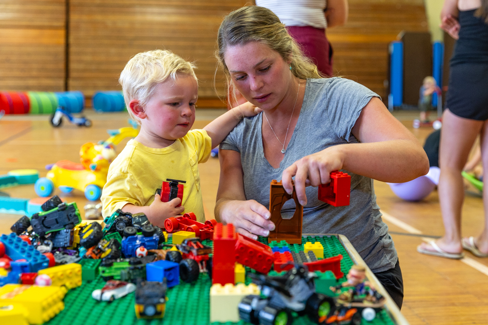 Mother and toddler playing with Legos