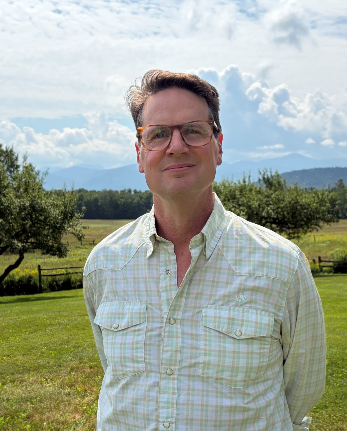 Man standing in front of mountain view