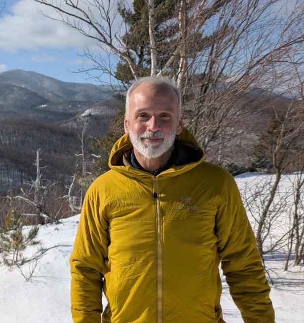 Man on snowy mountaintop