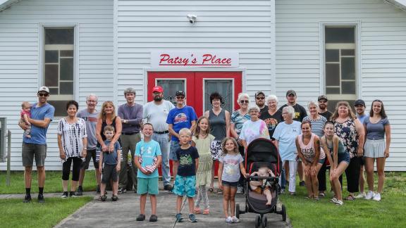 Group of people standing in front of community center