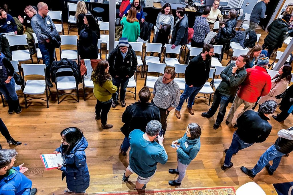 an overhead view of people standing and socializing